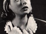 black and white photograph of a woman in a collared shirt