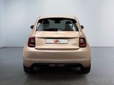 a car that is parked in a room with a white wall