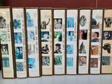 a lot of books that are lined up on a shelf