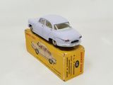 a white toy car sitting on top of a box