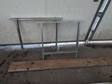 a picture of a table and a bench in a garage