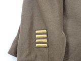 an image of a jacket with a gold patch on it