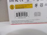 a close up of a white toilet with a barcode on it