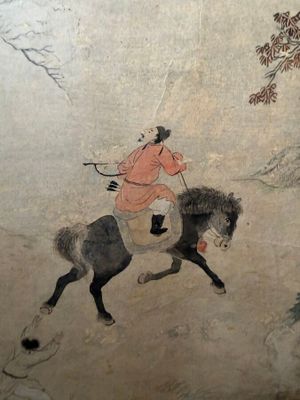 a painting of a man riding a horse on the wall