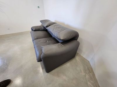 an image of a living room with a couch and a television