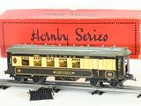 a toy train that is sitting on the tracks next to a box