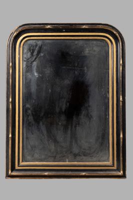 an antique black and gold framed mirror with a black background