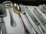 a table with silverware and silverware on it