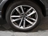 a close up of a tire on a car ' s rim