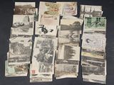a lot of old postcards on the table