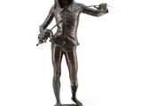 statue en bronze représentant une femme tenant un couteau et une fleur à la main