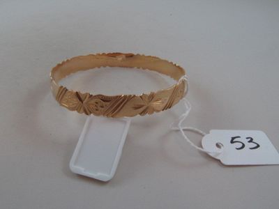 a gold bracelet with a price tag attached to it