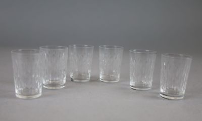six clear glass tumblers lined up in a circle on a table