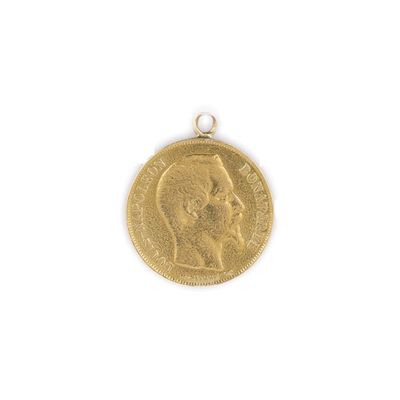 gros plan d'une pièce d'or sur laquelle figure le visage d'un homme