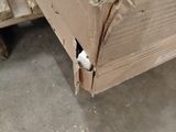 a piece of cardboard on the bottom of a bed