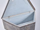 a small metal box that is open on a white surface