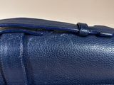 the inside of a blue purse with a zipper on it