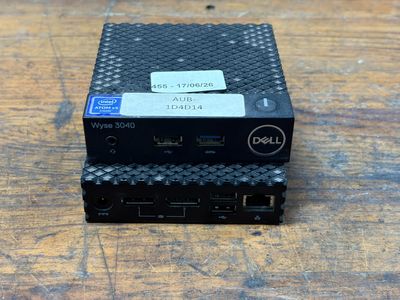a small black device sitting on top of a wooden table