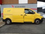 the yellow van is parked in front of the building