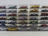 a lot of toy cars that are in a display case