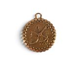 an image of a gold medal with a bird on it