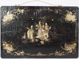 an image of a large black and gold painted box with flowers
