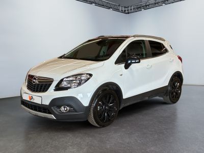 the white car is parked in a large room with white walls