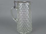 an image of a clear glass pitcher with a handle