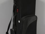 the back view of a black bag with a strap on it