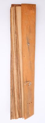 a piece of wood that has been cut and is hanging on the wall