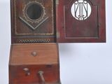 a small wooden box with a musical instrument inside of it