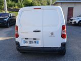 a white van that is parked in a parking lot