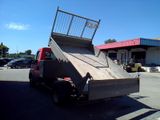a truck that has a ramp in the back of it