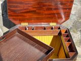 a small wooden box with a tray inside of it