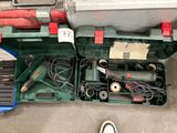 a green tool box with tools in it on the floor