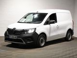 la photo d'une camionnette blanche garée dans un garage