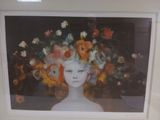 painting of a woman with flowers in her hair in a white frame