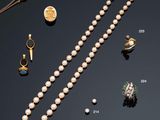 many different types of necklaces and bracelets on display
