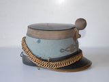 a hat with a chain around it on a table