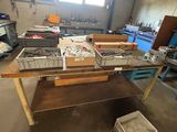 a table with a bunch of boxes on it in a room