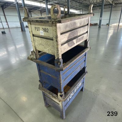 a blue cart with three drawers on it in a warehouse