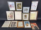 a lot of framed pictures on the table
