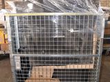 a large metal cage with a bunch of boxes in it