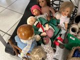 a lot of dolls that are sitting on a table