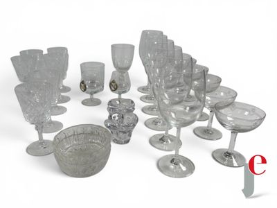 a lot of wine glasses and a bowl on the table