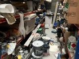 a room filled with lots of clutter and tools