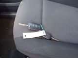a car key in the back seat of a car