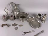 a lot of silver items that are on the table