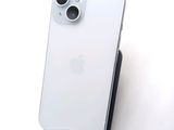 a white iphone sitting on top of a black stand