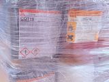 a large stack of boxes wrapped in plastic on a pallet